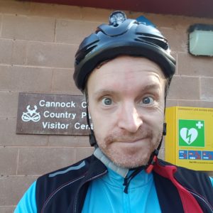 Me at Cannock Chase stood in front of the visitors centre sign.